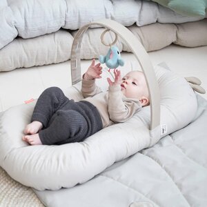 Done by Deer cozy lounger with activity arch Raffi Sand - Dooky